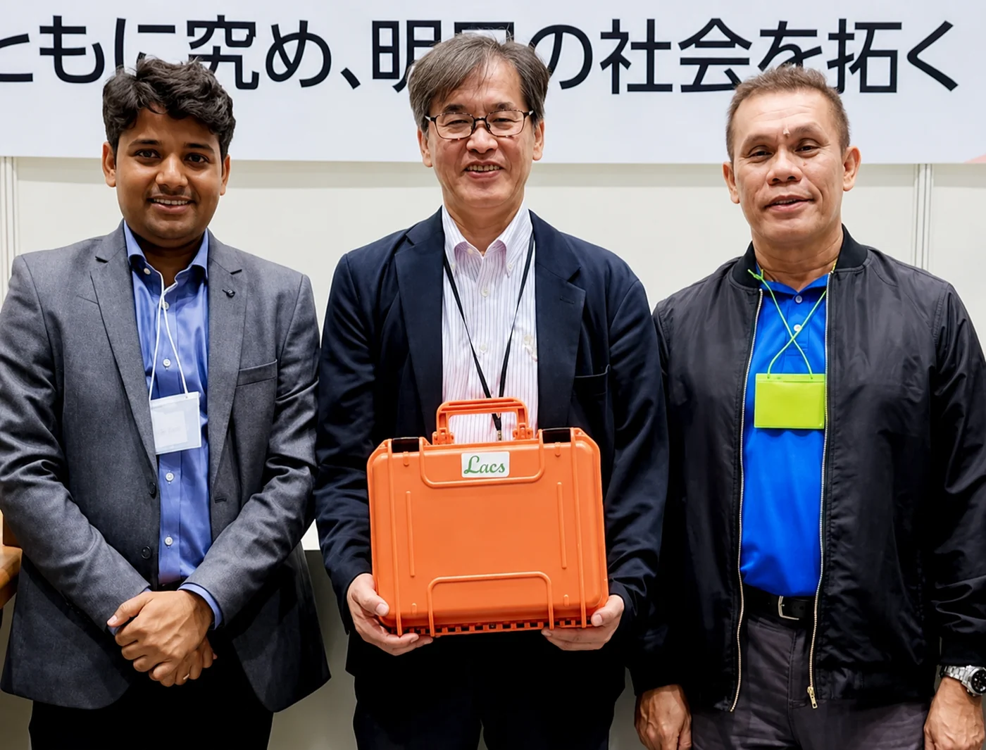 The Neiglobe team of three, with Toshikazu Sakano centre holding a portable LACS unit.